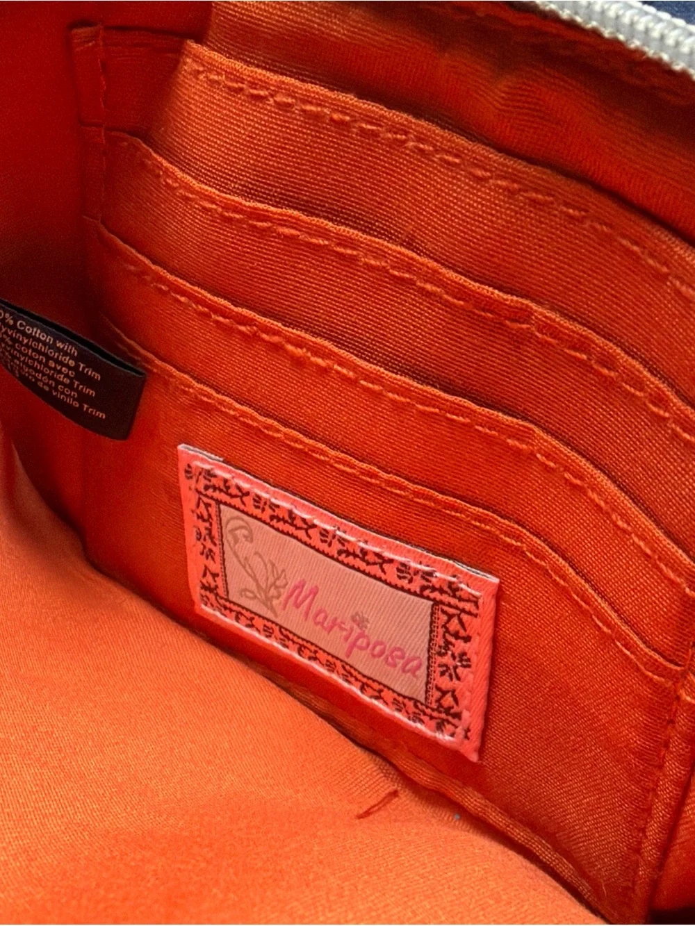Mariposa Floral Pattern Canvas Wristlet in Orange, Green, Blue, Brown, Cream